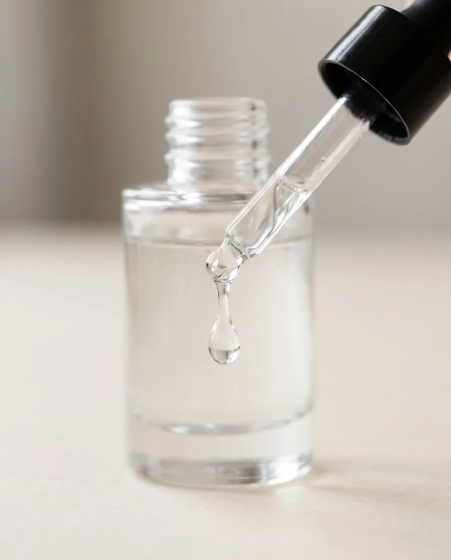 dropper serum bottle with active ingredients for oily skin