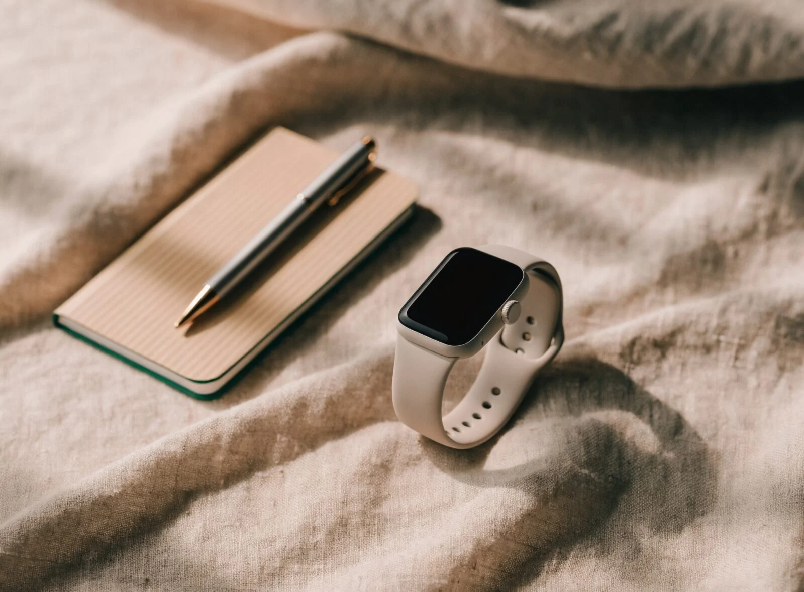 Fitness tracker smartwatch on a linen surface